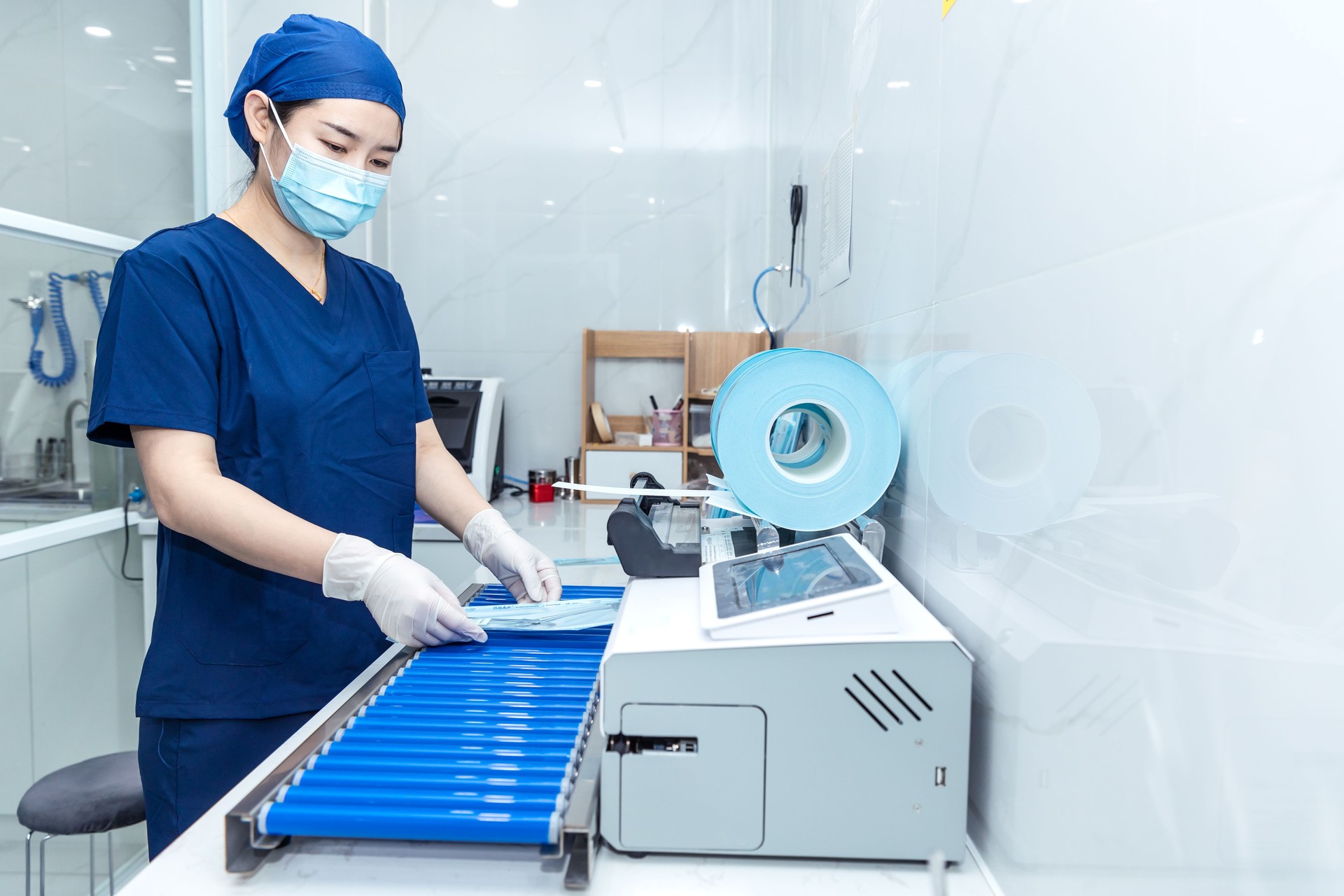 Nurse packing surgical tools to be sterilized